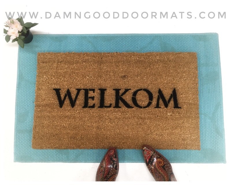 Promotional graphic for an all natural, sustainable, eco-friendly coir doormat made by Damn GoodDoormats