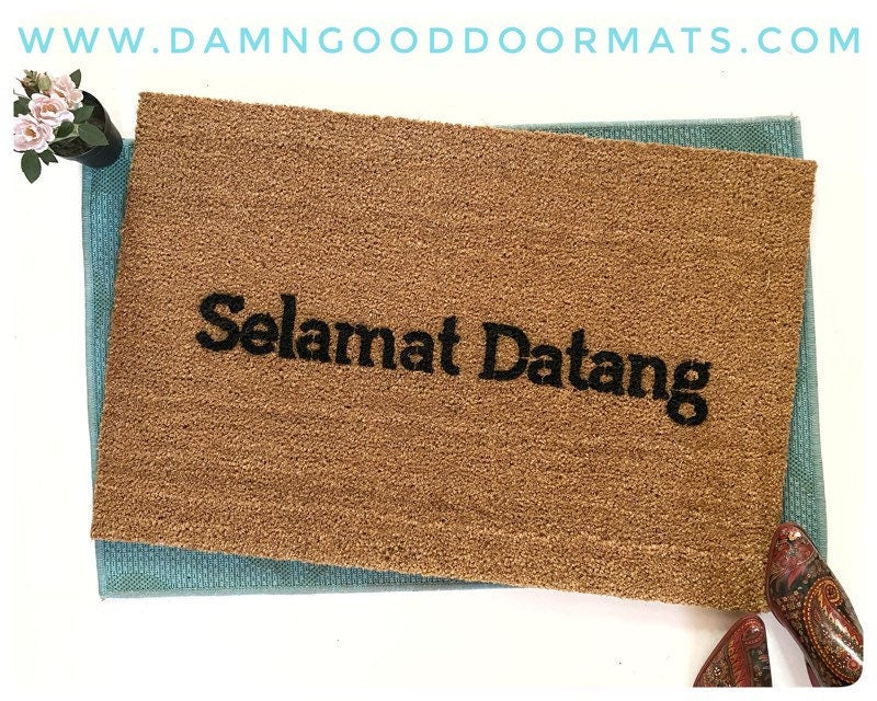 Promotional graphic for an all natural, sustainable, eco-friendly coir doormat made by Damn GoodDoormats