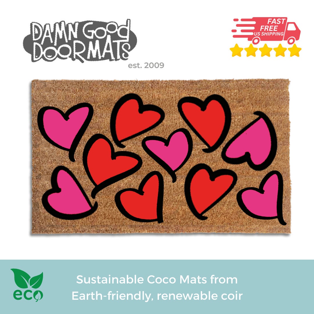 Promotional graphic for Damn Good Doormats coir valentines day doormat with pink and red hearts