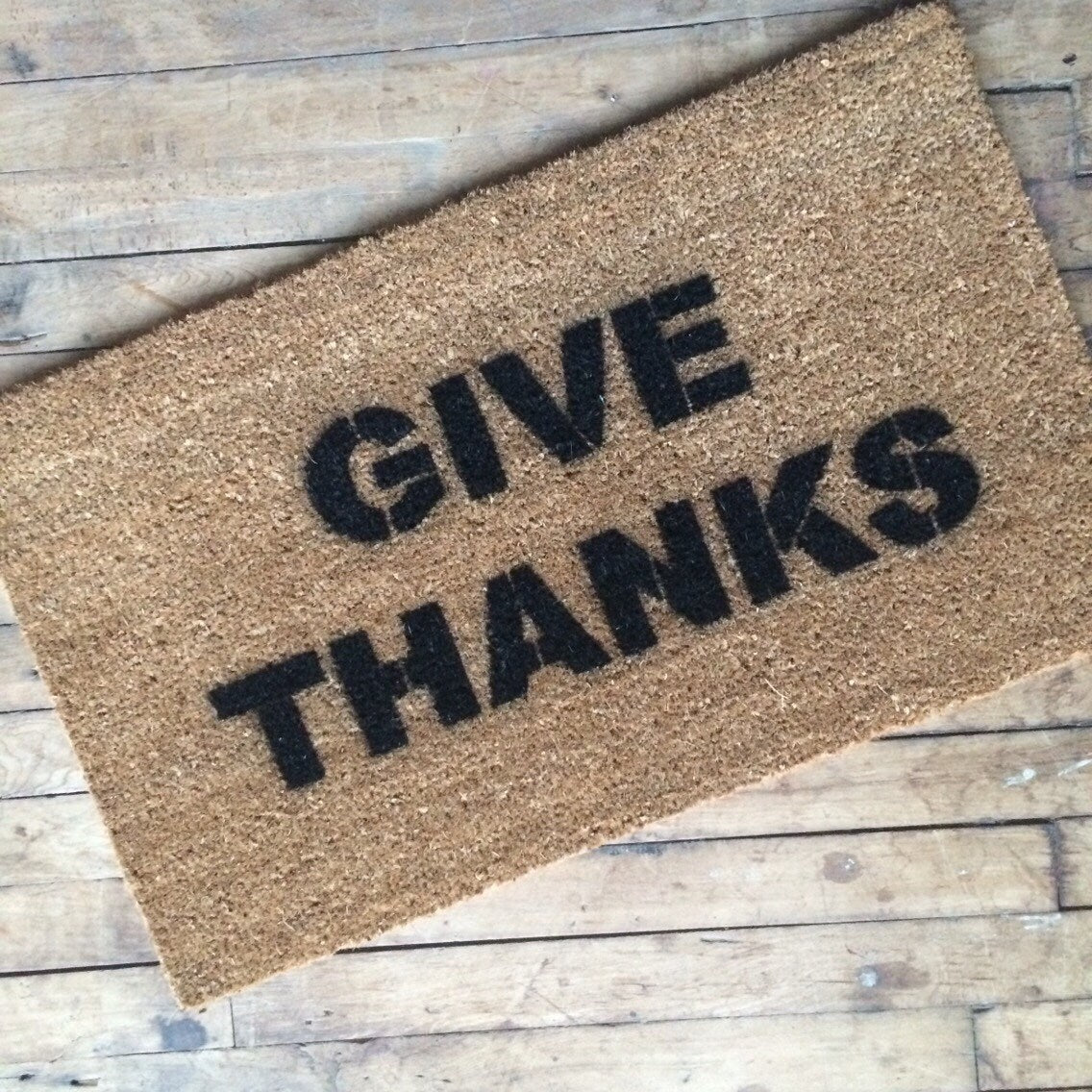 Promotional graphic for an all natural, sustainable, eco-friendly coir doormat made by Damn GoodDoormats